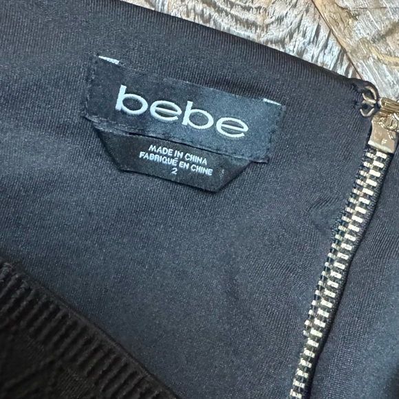 Bebe mini skirt fit and flare black with corset detail on top. Size 2 - Picture 3 of 5